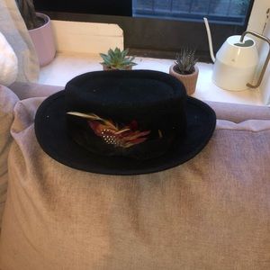 Bowler hat with feather